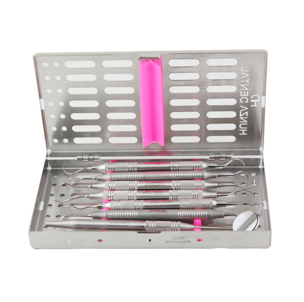 Dental periodontal maintenance kit with various scalers and curettes in a metal case with a pink inner handle.